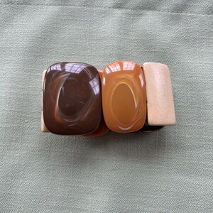 Stretchy elastic plastic bracelet 2” wide and 3” diameter when not stretched